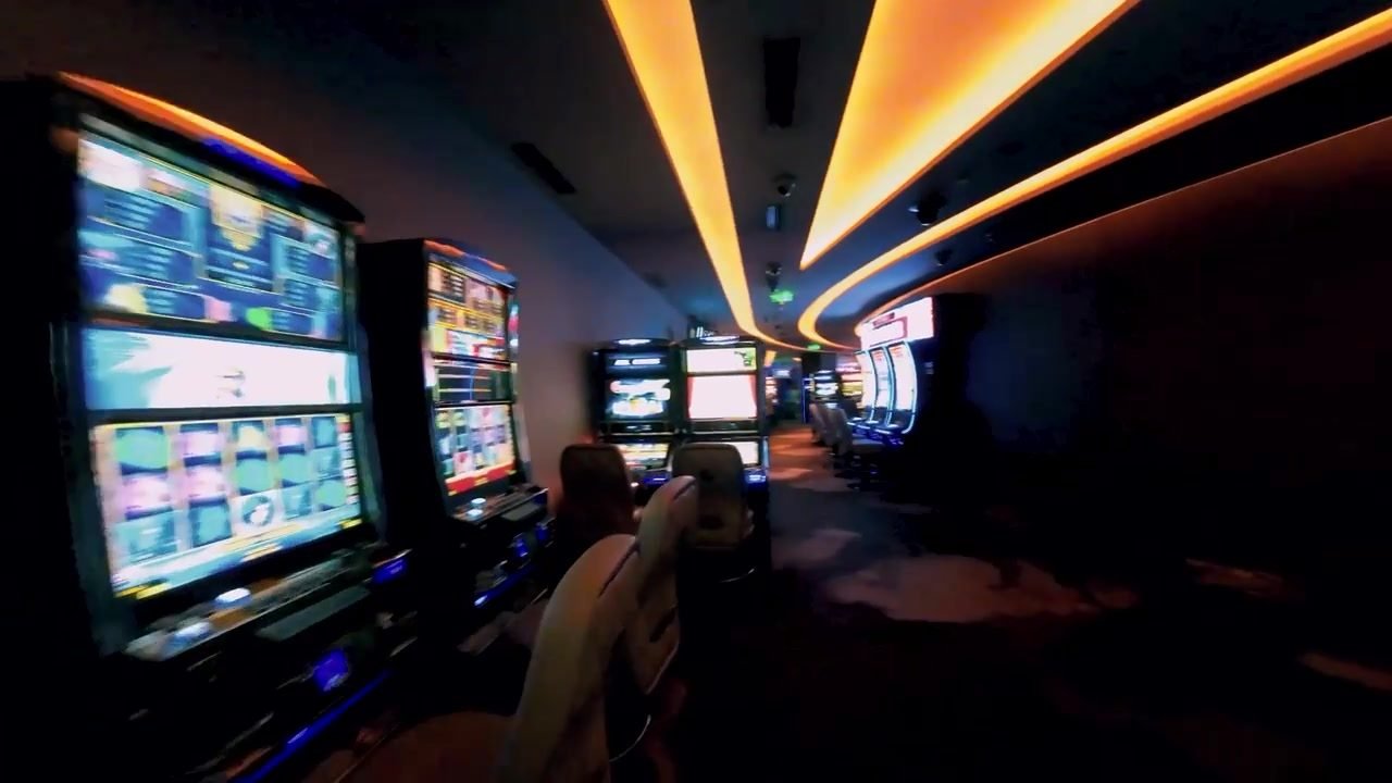 Slot machine screens glowing at night